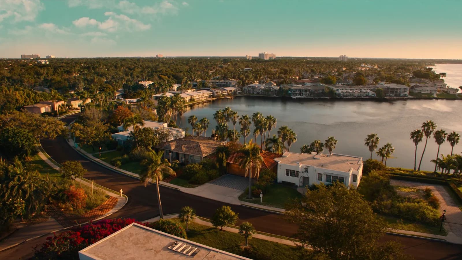 Historic homes on a curving lakeside street in Hollywood, Florida