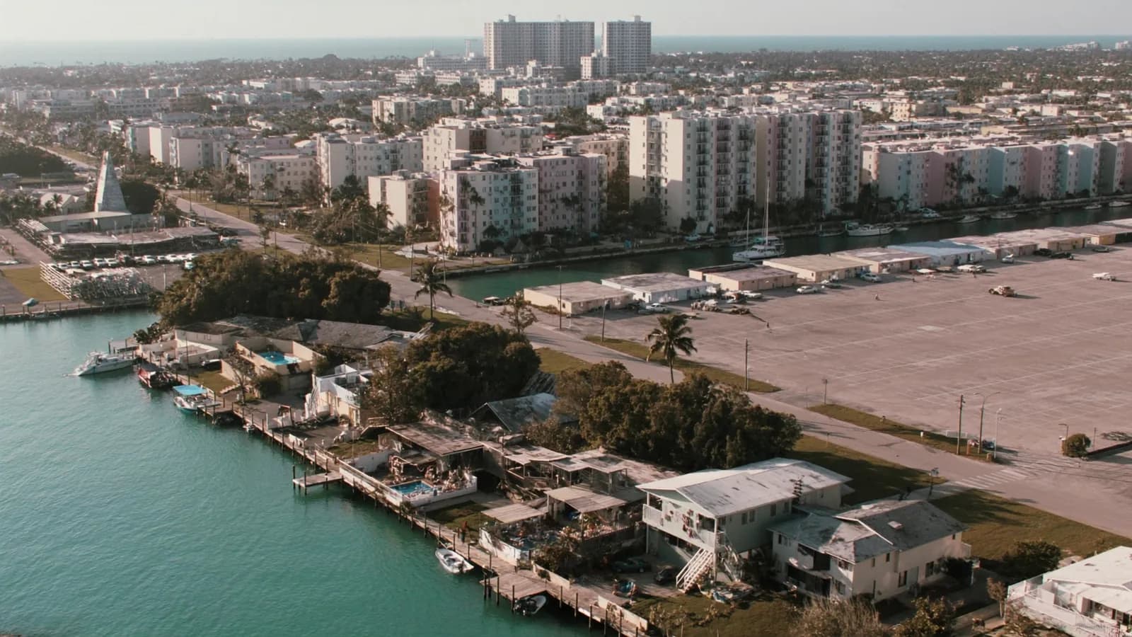 Aerial view of waterfront homes and older low-rise apartment buildings in North Miami Beach, Florida